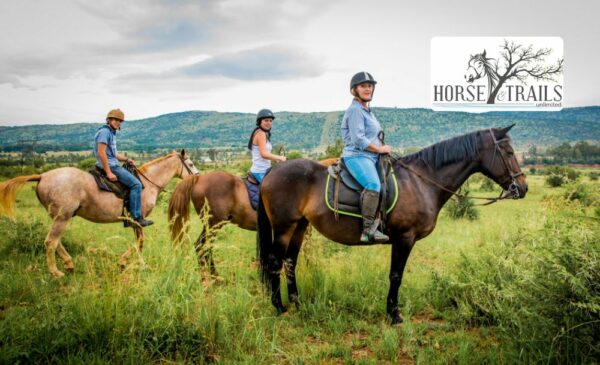 Three people enjoying a horse riding experience at Harties Horse and Trail Unlimited in Hartbeespoort.