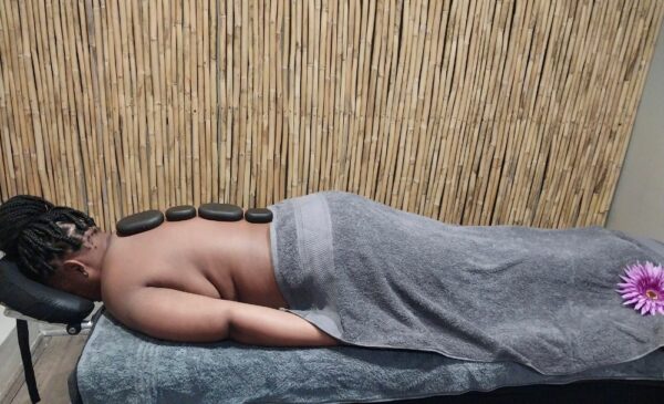 A woman having a massage at The Indigo Spa Pty Ltd in Midrand.