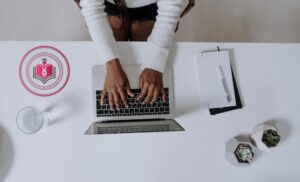 A person typing on a computer doing the Essential Digital Skills Course from Lead Academy.