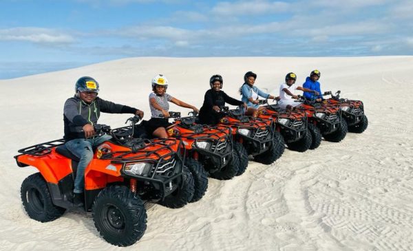 A group of people enjoying quad biking at Atlantis Dunes from Wild X Adventures