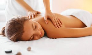 A stock photo of a woman receiving a massage