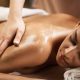 A stock photo of a woman receiving a full-body massage