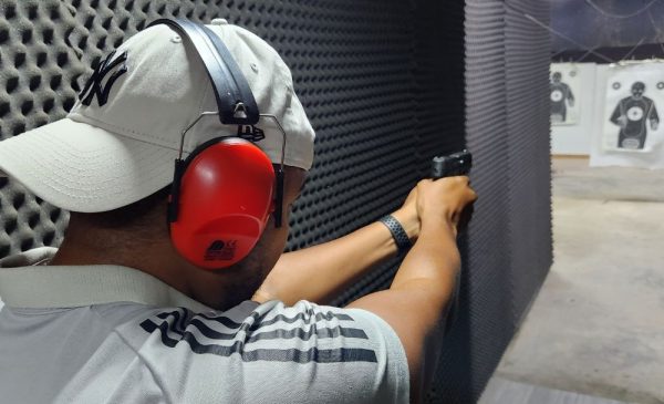 A man aiming at a target during a shooting experience at Kolshoot Potshot in Randburg