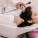 A stock photo of a woman having her hair washed in a hair salon