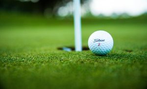 A stock photo of a golf ball on a golf course