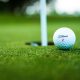 A stock photo of a golf ball on a golf course