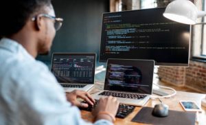 A stock photo of a man coding