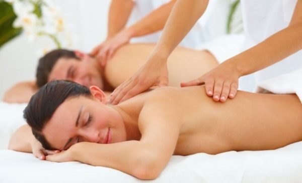 A stock photo of a couple having a massage at the spa