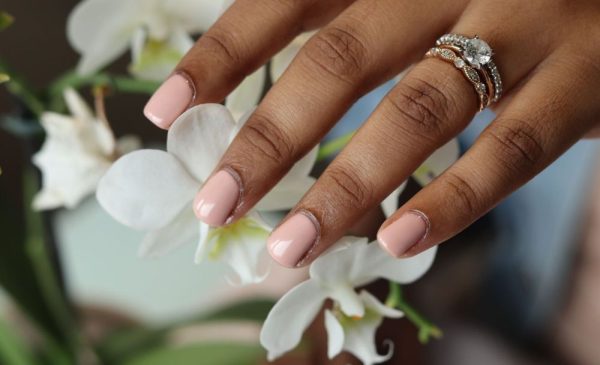 A woman with gel nails from BG Aesthetics in Durban North