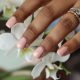 A woman with gel nails from BG Aesthetics in Durban North