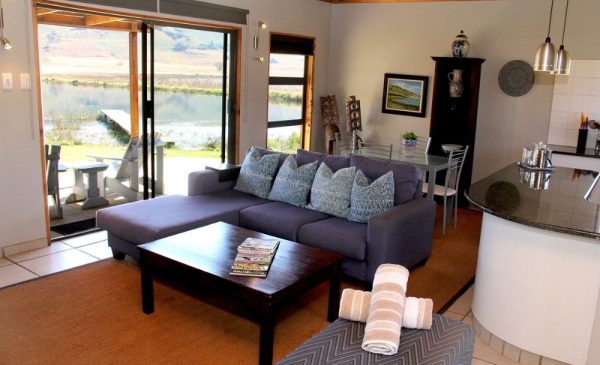 The sitting room area at the Early Mist Lodge from Sani Valley Nature Lodges in Himeville