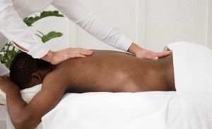 A stock photo of a man getting a massage at the spa