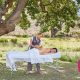 A woman getting a massage outdoors from Wellness in the Winelands at Lourensford Estate in Somerset West