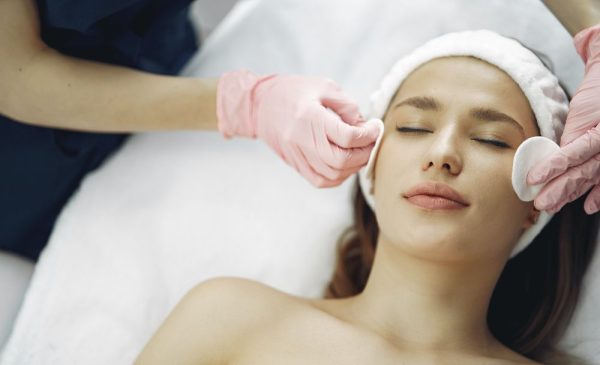 A stock photo of a woman getting a facial at the spa