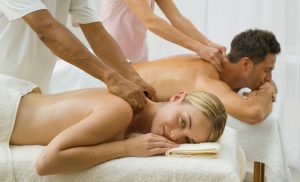 A stock photo of a couple getting a massage at the spa