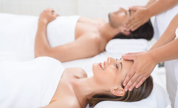 A stock photo of a couple having a massage at the spa