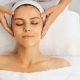 A stock photo of a woman getting a head massage at the spa